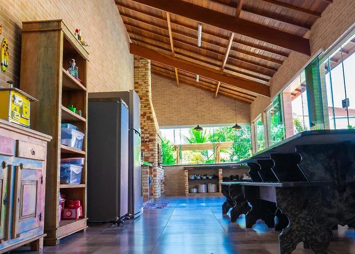 CASA PREMIUM em Peruíbe com FOGUEIRA, Brinquedoteca, Piscina, Lareira de Jardim, Churrasqueira e 4 grandes quartos para 16 pessoas!